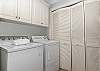 Outside of the master bedroom is the laundry room that has a full sized washer and dryer!