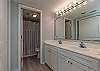This ensuite has a double vanity, lots of light, a large closet and private tub/shower area.