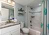 Charmingly remodeled guest ensuite with tub/shower combo. 