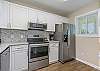 The kitchen is beautifully remodeled with all new stainless steel appliances, gorgeous granite and re-faced cabinets. 