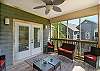 Great screened porch with plenty of seating and a ceiling fan to keep the breeze. 