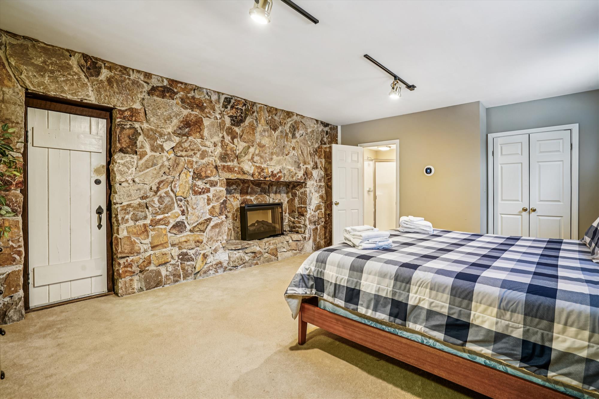 Bedroom with Stone Fireplace