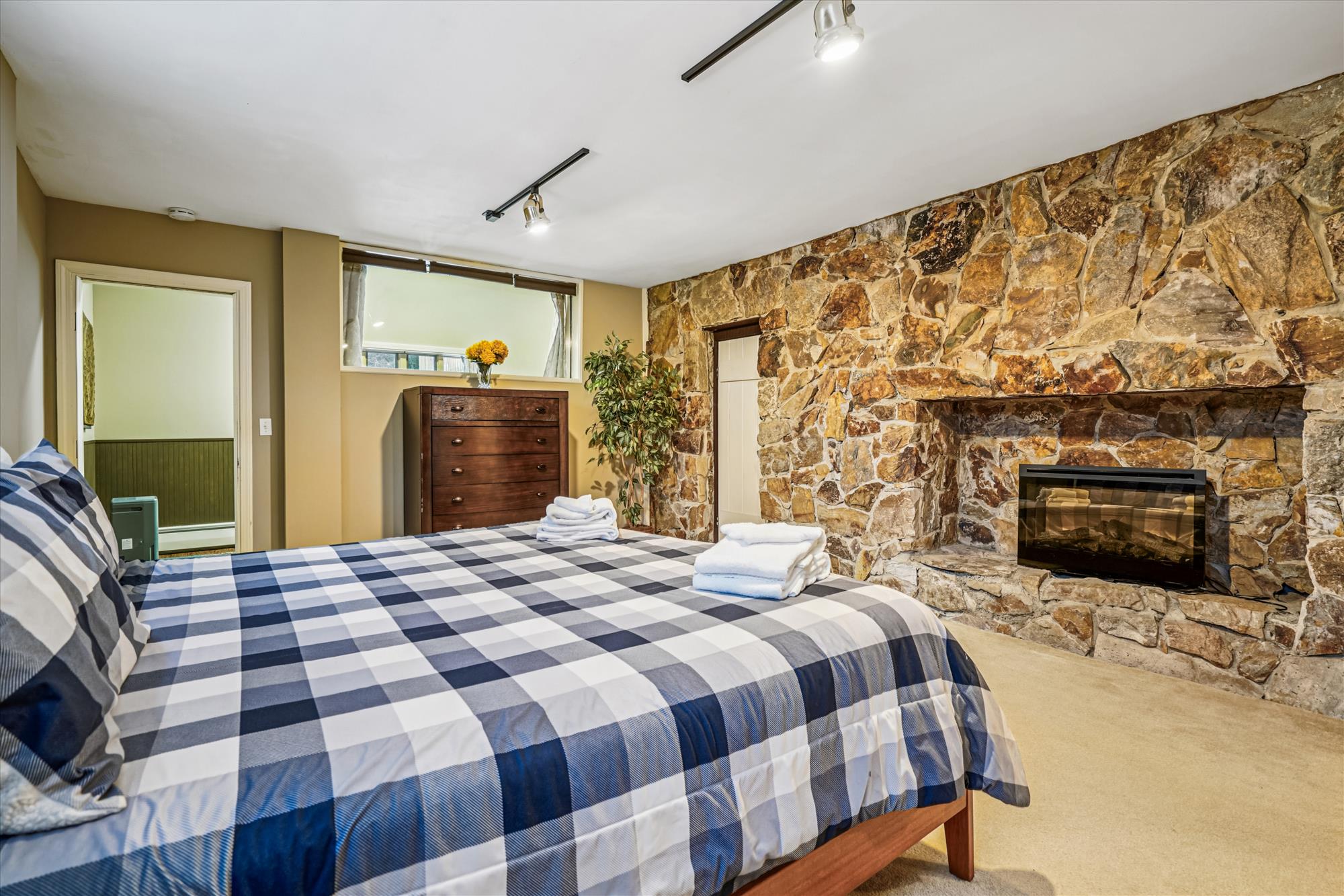 Bedroom with Stone Fireplace