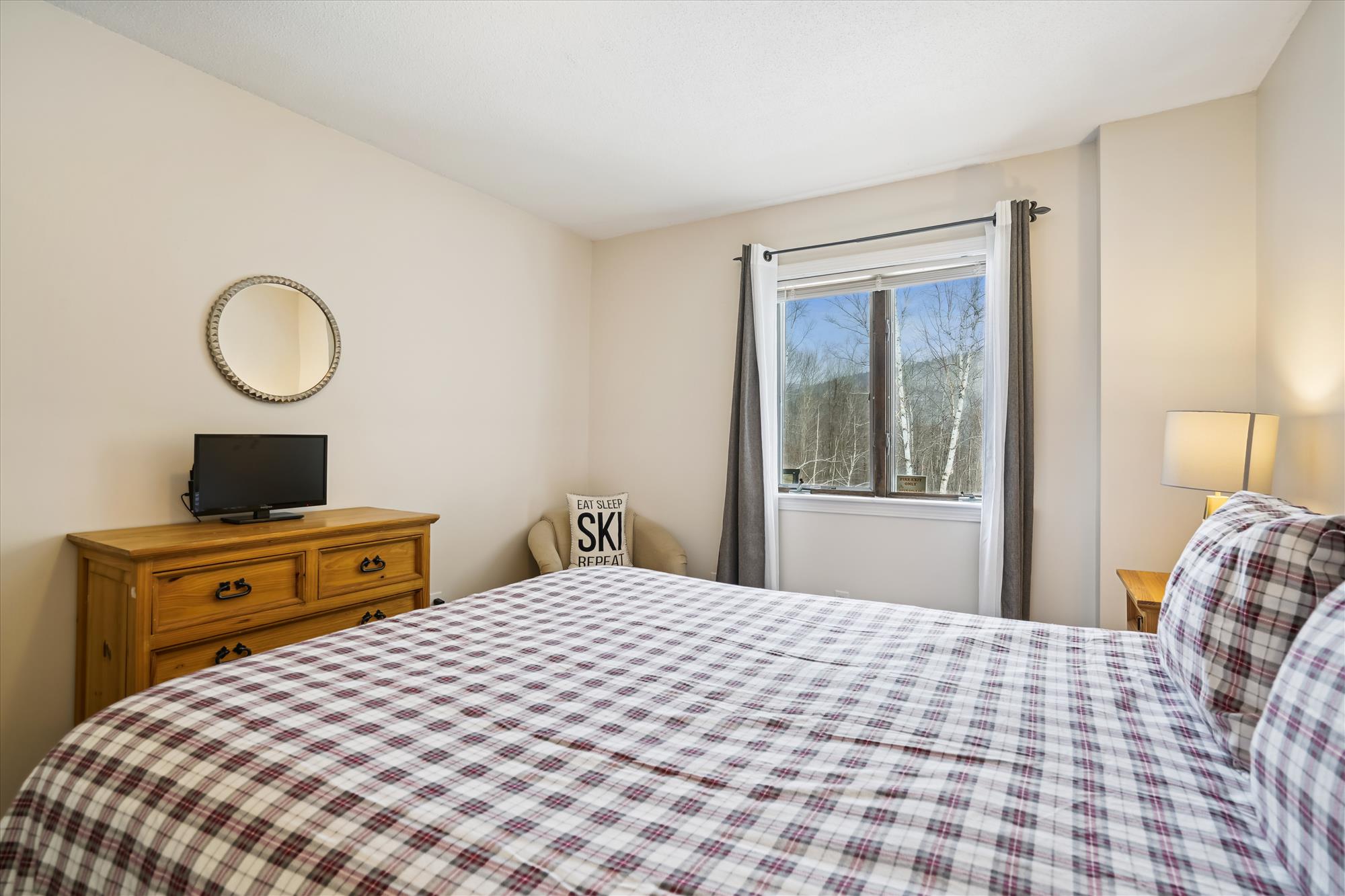 Bright Bedroom with Seasonal Views
