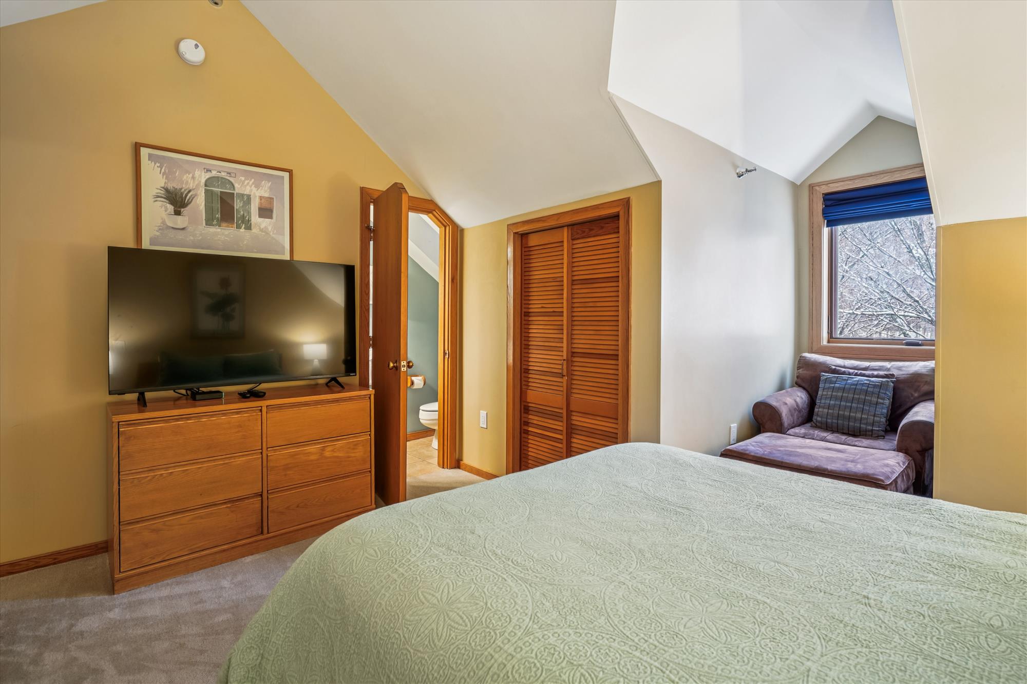 Queen Bedroom with TV and Seating Area