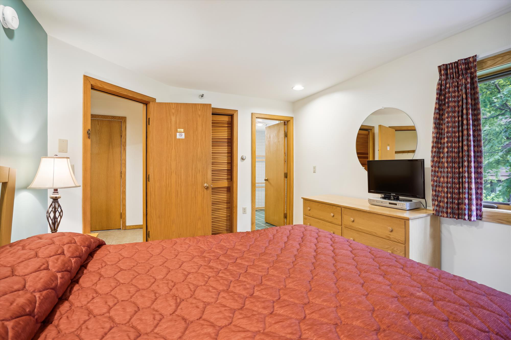 Inviting Guest Room with TV and Storage