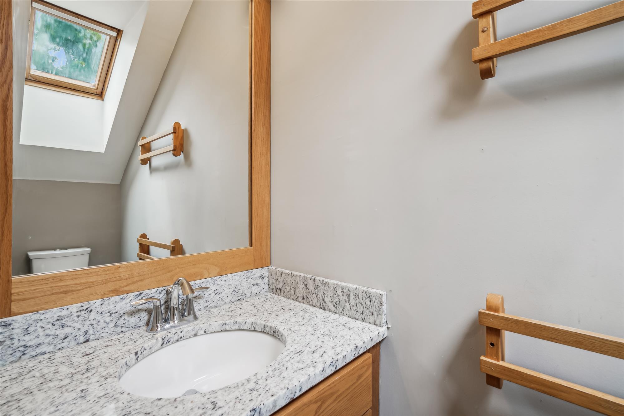 Bright Loft Bathroom with Skylight