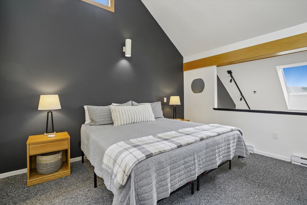 Queen Bed Beneath Vaulted Ceilings
