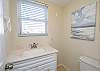 This half-bath is located on the second floor where the living room and kitchen are located.