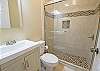 Newly renovated guest bathroom with walk-in shower located directly outside of the Queen Guest bedroom.