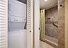 Walk in shower and convenient stackable washer & dryer.