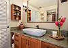 Private bath with tub/shower combo just around the corner from your king bed.