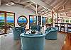 Living area is open and spacious with high vaulted ceilings