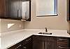 Plenty of counter space in this laundry room.