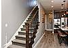 Just off the kitchen is the Stairway leading to the upstairs family room and 3 additional bedrooms