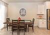 The Dining Room comfortably accommodates 6 adults at the dining table.  4 bar stools are also located at the kitchen island.