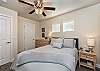 Bedroom 2 is furnished with a Queen size bed and inculdes a private TV, night stands, lamps, and ceiling fan.