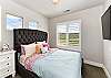 Bedroom 2 is furnished with a Queen Bed, private TV, night stand, and includes a walk-in closet.