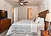 Side view of Main bedroom showing private bathroom and TV.