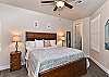 The Main bedroom is furnished with a plush King bed, private satellite TV, and walk-in closet. 