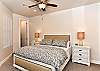 The Main bedroom is furnished with a plush King bed, private satellite TV, and walk-in closet.