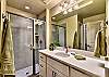 The upstairs Main Bathroom includes a large walk-in shower, sink, toilet, and vanity.