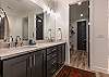 The Main bathroom that is adjacent to the Main bedroom is large and luxurious. With his and her sinks, toilet, vanity, walk-in shower, large bathtub and a large walk-in closet.