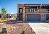 Front View of our home showing the large patio space above where we keep the fire pit. 