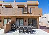 The Back Patio includes an outdoor dining table, BBQ grill, and sliding glass door that leads into the living room.