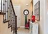 The Main Hallway leads to the Master Bedroom, Kitchen, Dining Room, and Living Room.  The Stairway leads to the Upstairs Bedrooms and Family Room.