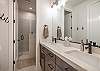 Ledges Bathroom includes a large walk-in shower, his & hers sinks, toilet, and vanity.