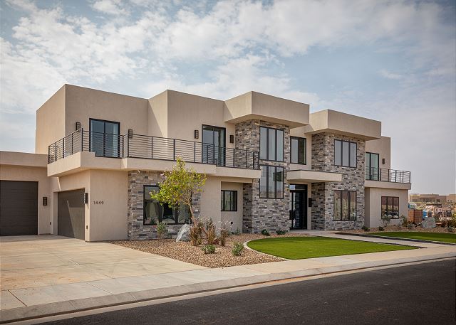 Side view of our home shows the garages and beautiful exterior. 