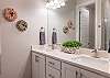 The Main bathroom that is adjacent to the Main bedroom is large and luxurious. With his and her sinks, toilet, vanity, walk-in shower, large bathtub and a large walk-in closet.