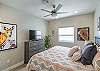 Bedroom 2 on the main level includes a King bed, private TV, and closet.  Bathroom 2 is located adjacent to Bedroom 2.