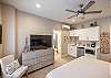 A pocket door provides privacy for the ensuite bathroom while the kitchenette offers the in-room convenience of preparing a snack and coffee.
