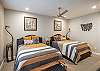Bedroom 4 is a large bedroom on the lower level which includes two queen beds, private closet, and private TV.