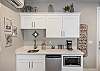 The casita kitchenette includes a sink, microwave, coffee maker, and large mini-fridge. The kitchenette is also stocked with dishware, and all the extras to make your stay comfortable.
