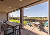The back patio provides a firepit and plenty of seating for your guests. 