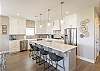 The kitchen is complete with everything you will need for meal preparations.  The gourmet kitchen includes a large farmhouse sink, 5-burner gas cooktop, and 2 full size dishwashers, ovens, & refrigerators.
