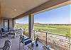 This back deck area, with large firepit table, is the perfect place to enjoy the golf course views!