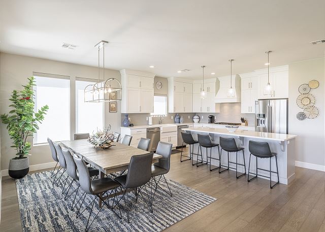 With an open and spacious floor plan, the Dining Room and Kitchen can accommodate meal preparations for groups large or small. 