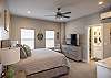 The casita bedroom with private entrance includes King bed, private bathroom with deep tub/shower combo, walk-in closet, and kitchenette.