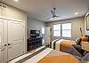 Bedroom 4 is located on the lower level and includes private TV and closet. 