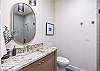  Bathroom 4 has a modern look with light wood vanity.