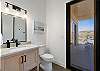 This bathroom is conveniently located in the hallway between the kitchen and game room. It also has a door to the back patio and pool area, so you don't have to walk through the house to get to a bathroom.
