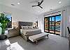 This main bedroom has all the elements needed to relax after a long day. With a gorgeous view right out the window, it is the perfect way to start and end your day. 