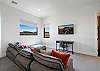 Bedroom 5 includes a large sitting area, desk and private TV. 