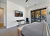 Bedroom 2 view of Private TV and sliding glass door. 