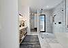 Have your choice of an indoor or outdoor shower. The large, walk-in shower in the main bathroom has a door opening up to a beautiful outdoor shower.