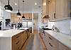 The kitchen is fully stocked with all the dishes, cookware, baking pans, and cutlery you will need for meal preparations and includes stainless steel appliances and granite counter tops.